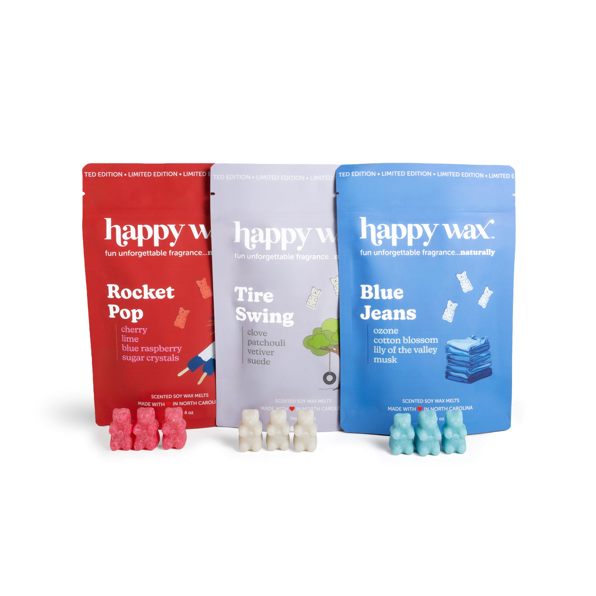 Three 'happy wax' scented wax packages on a white background.