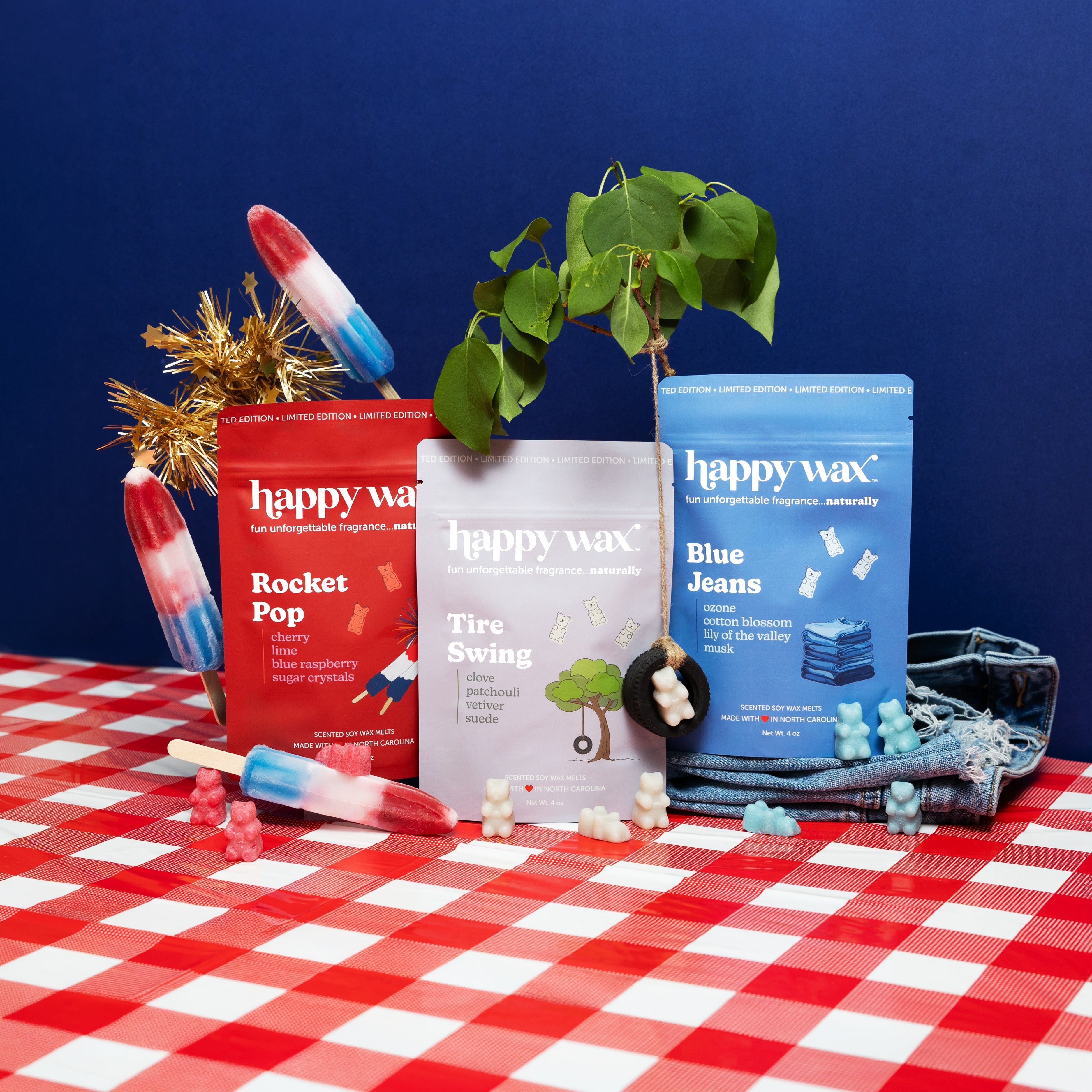 Happy Wax Americana wax melt pouches on a red and white checkered tablecloth with a blue background