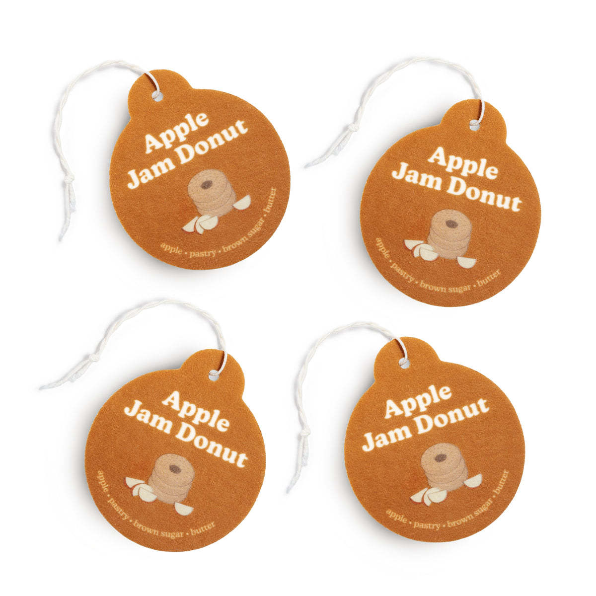 Four Happy Wax Apple Jam Donut Car Charms on white background