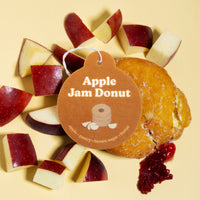 Happy Wax Apple Jam Donut Car Charm with apples and Apple Jam donut on pale yellow background