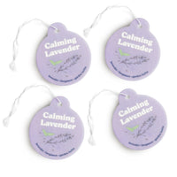 Four purple circular car charms with white strings, printed with "Calming Lavender" text and lavender plant illustrations.
