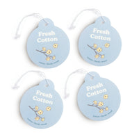 Four light blue circular car charms with white string attached, each featuring "Fresh Cotton" text and dried cotton flower il