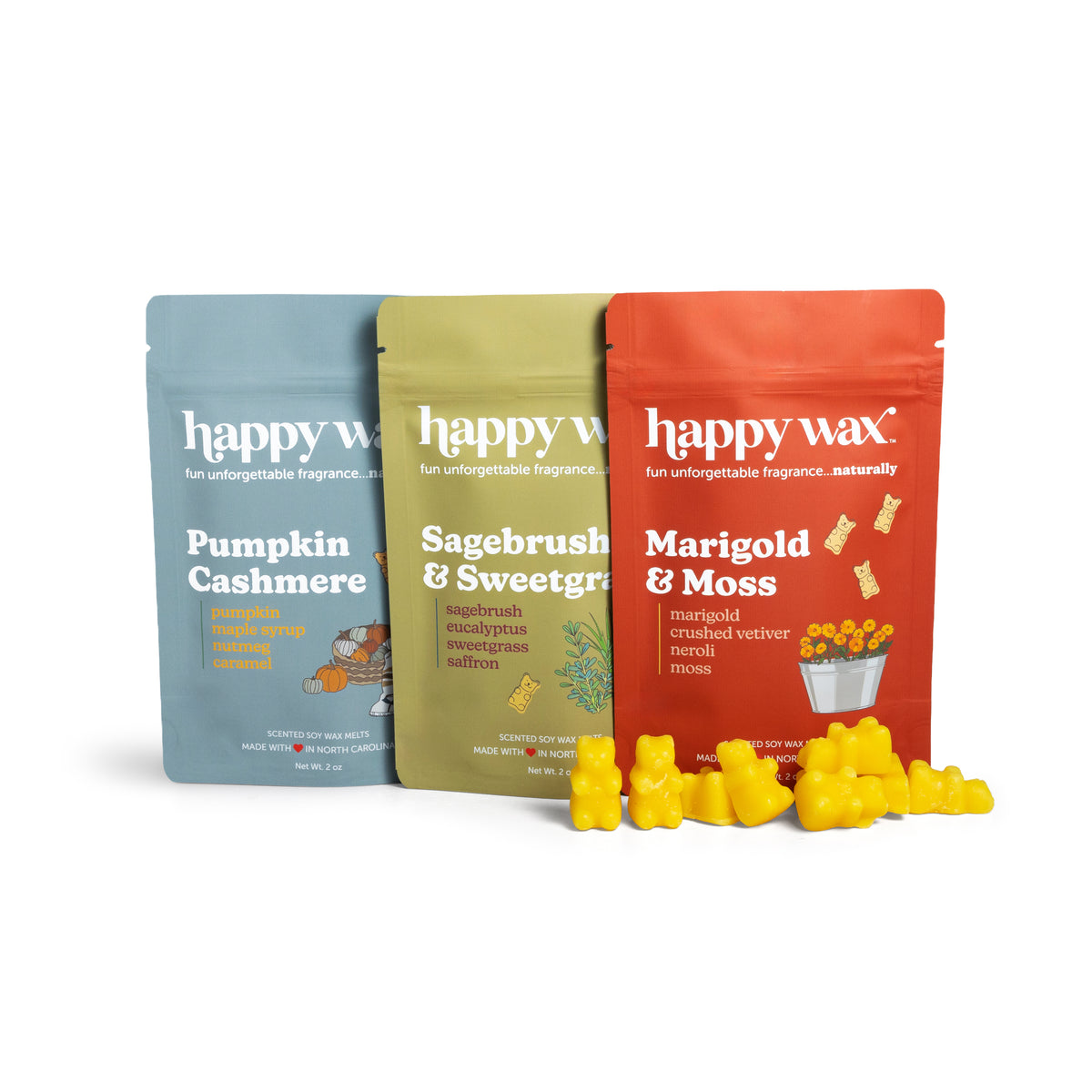 Happy Wax Field Notes 3 Pack of pouches, including Pumpkin Cashmere, Sagebrush & Sweetgrass and Marigold & Moss with yellow wax bears on white background