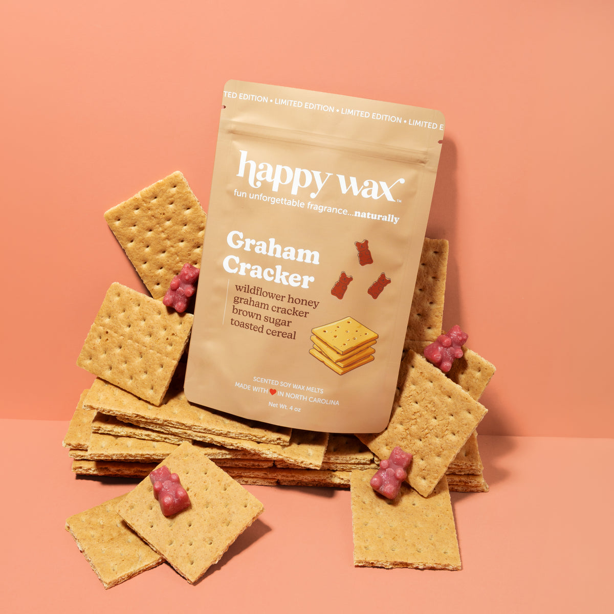 Happy Wax Graham Cracker Pouch on graham crackers with burgundy wax bears on peach background