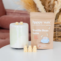 White ceramic wax warmer with two bear-shaped wax melts on top, surrounded by additional melts, next to Vanilla Bean Latte sc