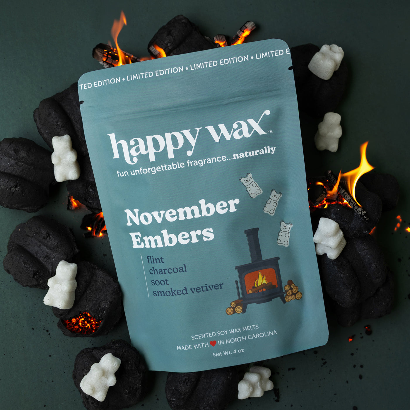 Happy Wax November Embers with coals, glowing embers and grey wax bears on dark muted green background