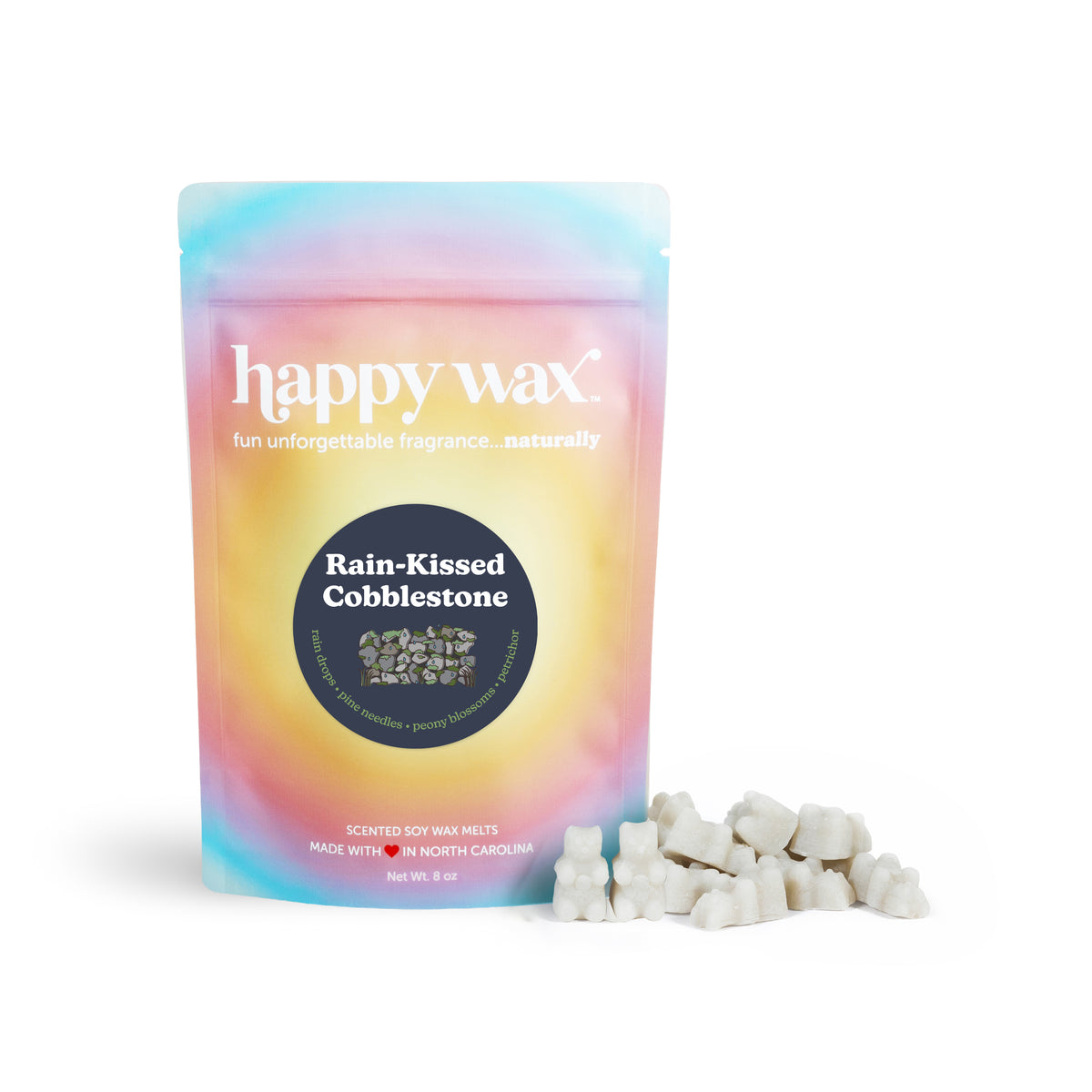 Gradient pastel pouch of Happy Wax soy wax melts with white wax chunks displayed in front.