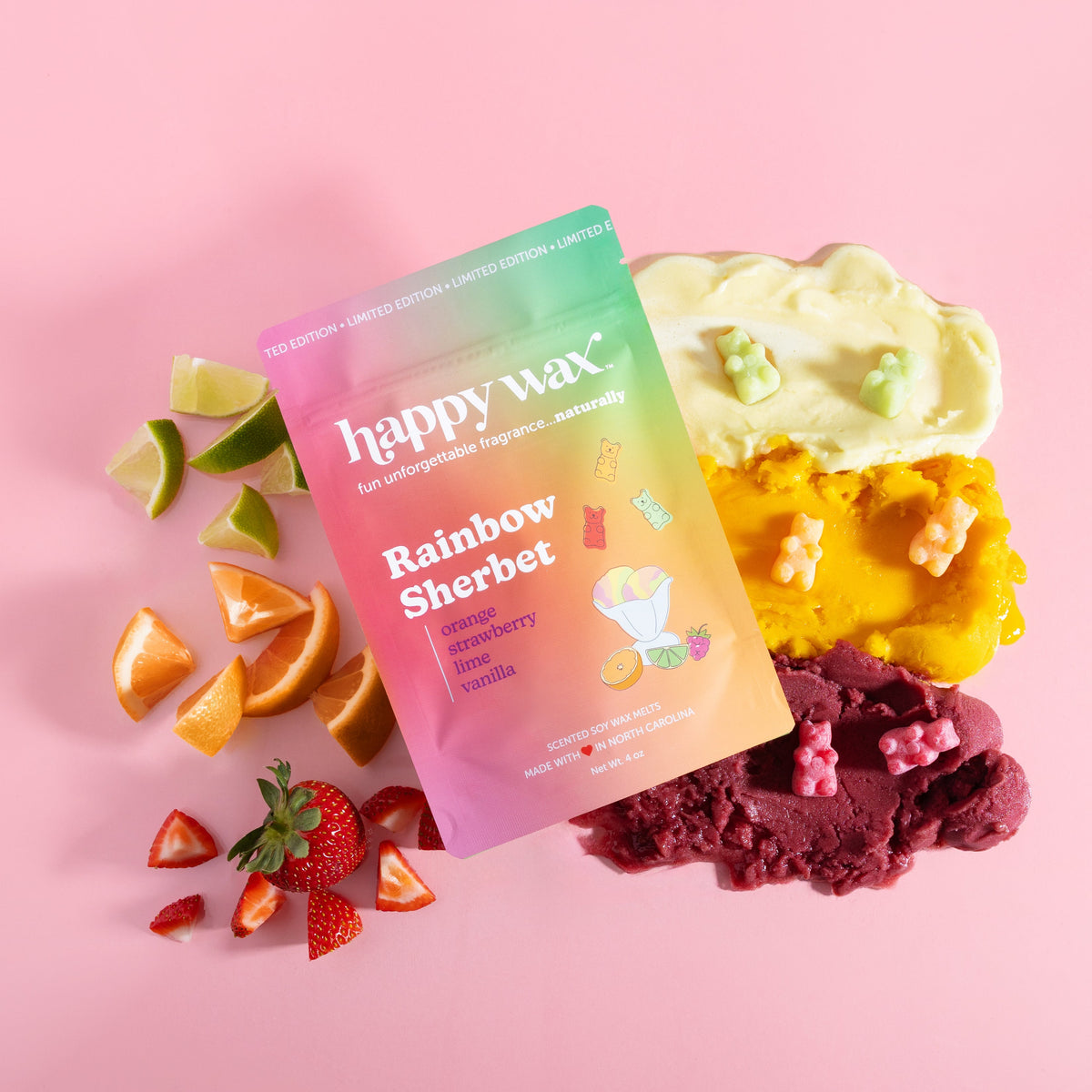 Happy Wax Rainbow Sherbet wax melt packaging with colorful wax melts on a pink background