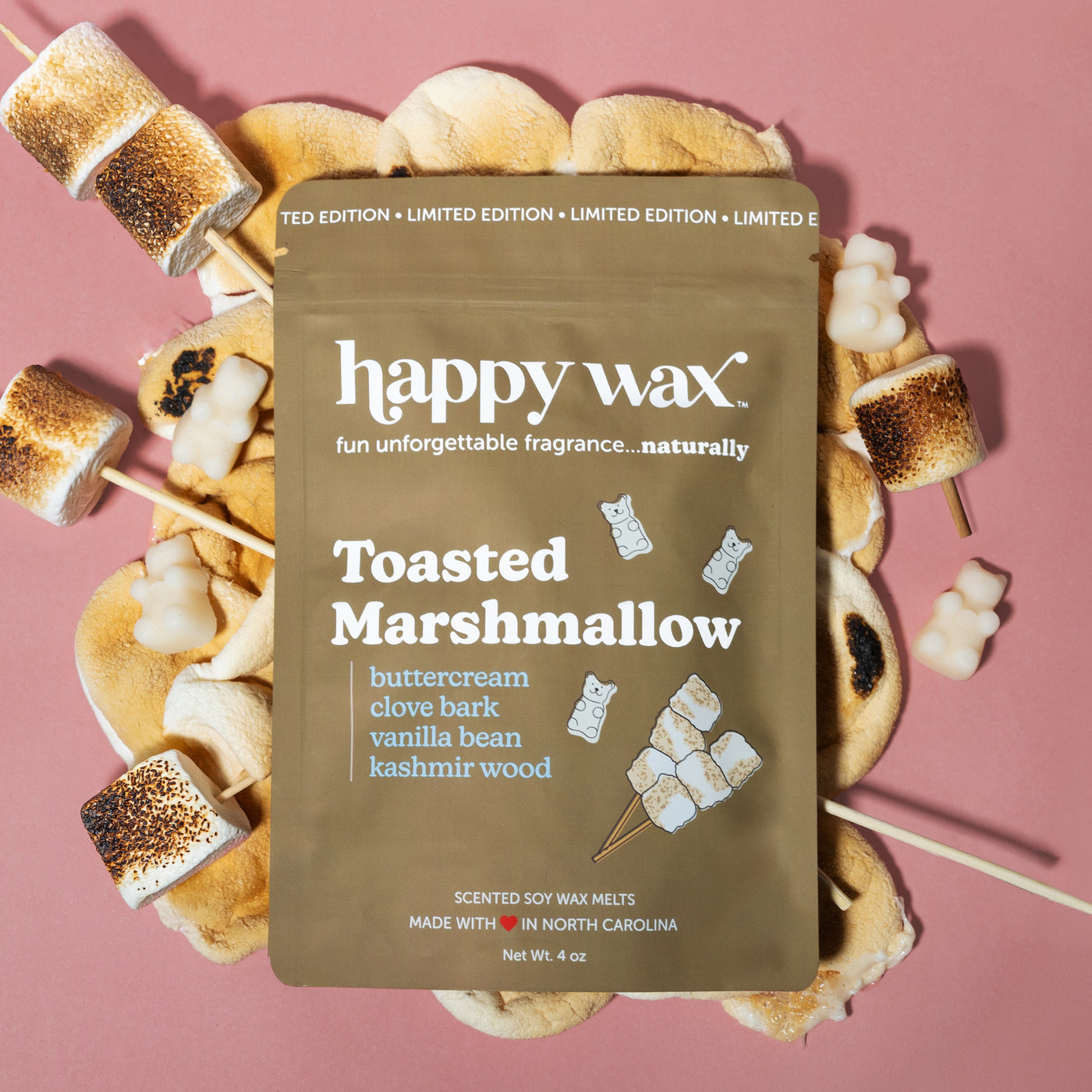 Happy Wax Toasted Marshmallow Pouch with toasted marshmallows on pink background