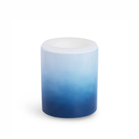 Cylindrical wax warmer with white lid and ombre gradient from light blue to dark blue.