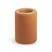Cylindrical wax warmer in terracotta with a centered circular opening and removable lid.