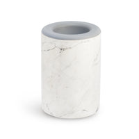 Cylindrical wax warmer with white marble texture and gray rim on top.