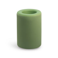 Sage green cylindrical wax warmer with circular opening on top.
