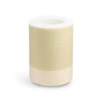 Cylindrical wax warmer with cream-colored body, white top ring, and central heating chamber.