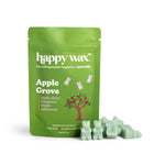 Green pouch of Happy Wax Apple Grove scented soy wax melts with pale green wax melts displayed in front.
