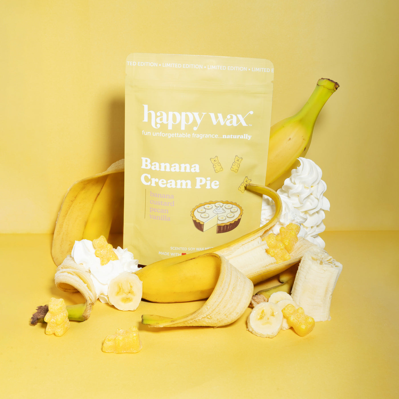 Happy Wax Banana Cream Pie wax melt package with bananas and whipped cream on a yellow background