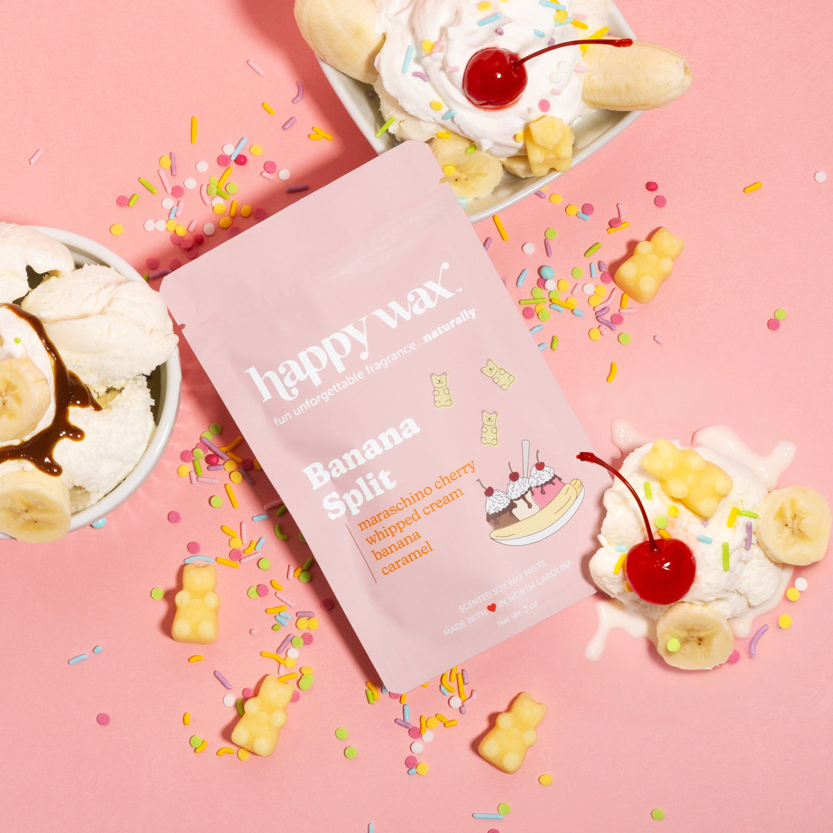 Banana Split scented wax melts pouch on pink background with ice cream, cherries, and sprinkles