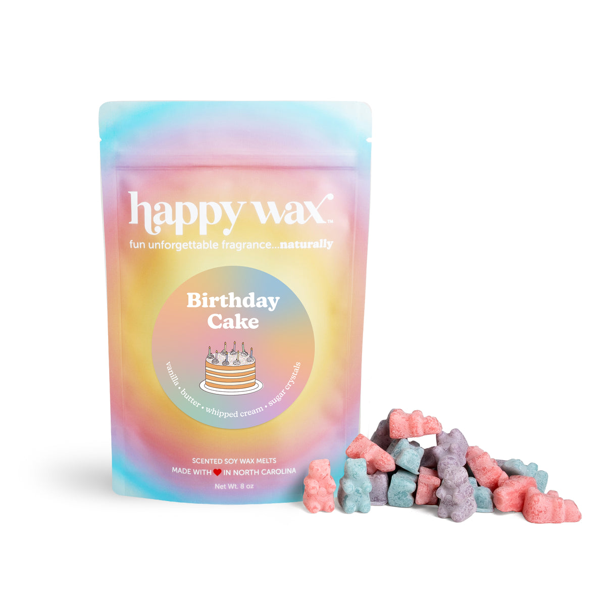 Rainbow gradient pouch of happy wax brand Birthday Cake scented soy wax melts in pink, blue, and purple chunks.