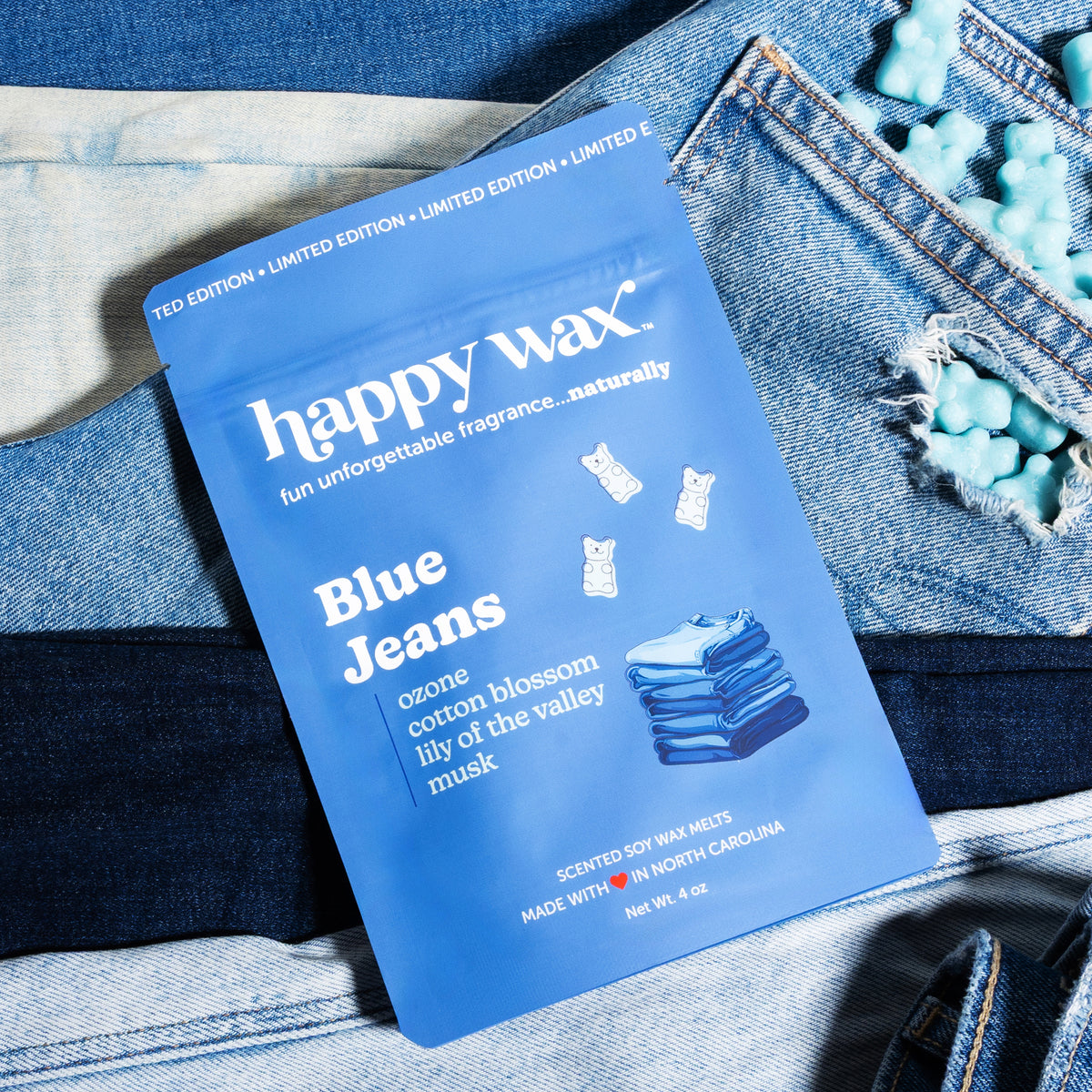 Blue jeans wax melts pouch on stack of blue jeans with wax bears coming out of pocket