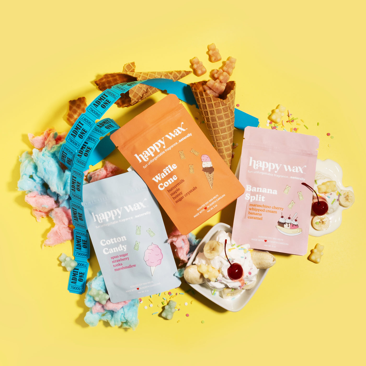Happy Wax wax melts packaging with carnival designs on a yellow background