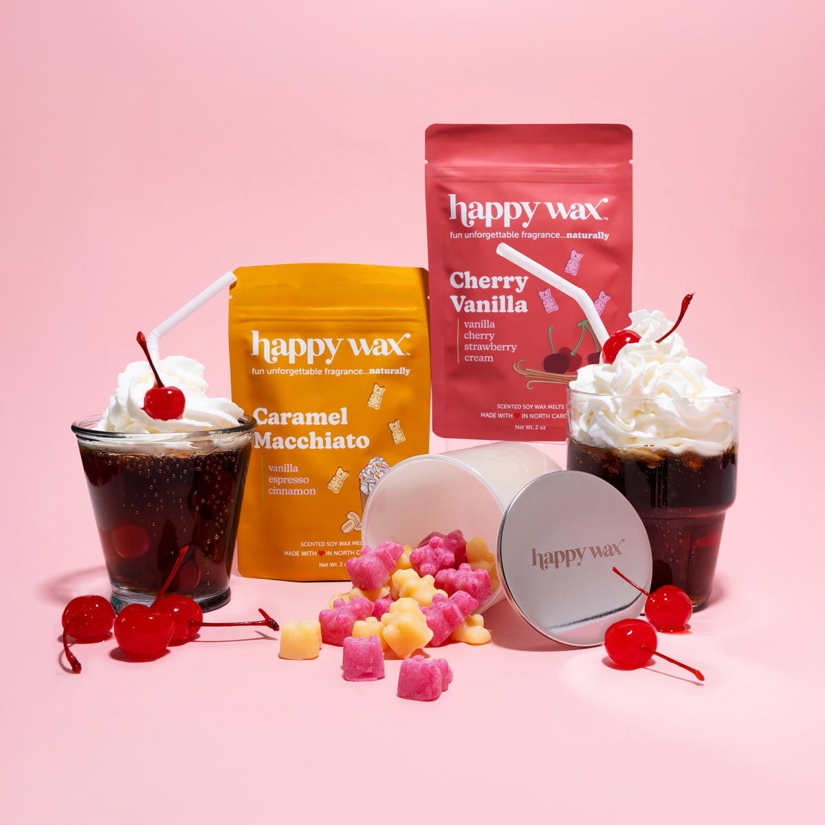 happy wax melt pouches with iridescent jar on pink background with soda floats and cherries