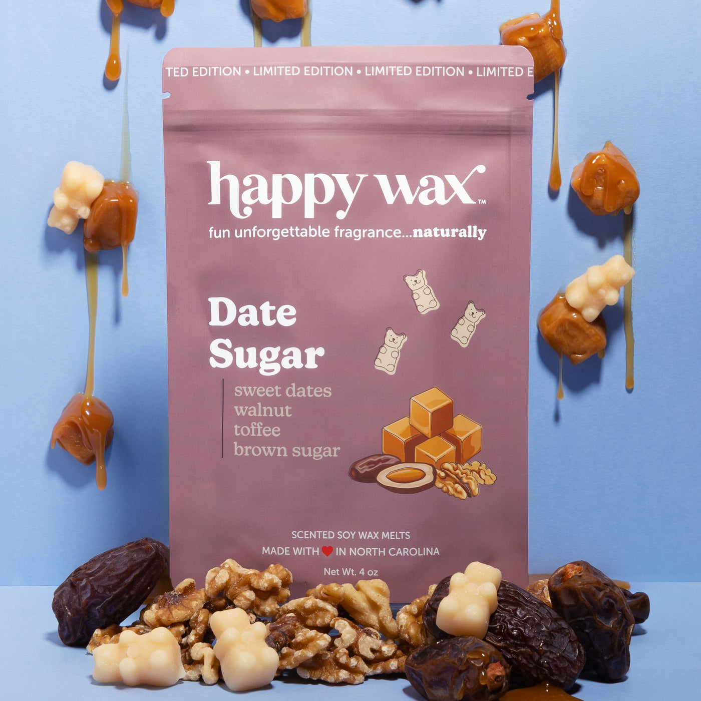 Happy Wax Date Sugar Pouch sitting on dates with walnuts with dripping caramel candies on blue background