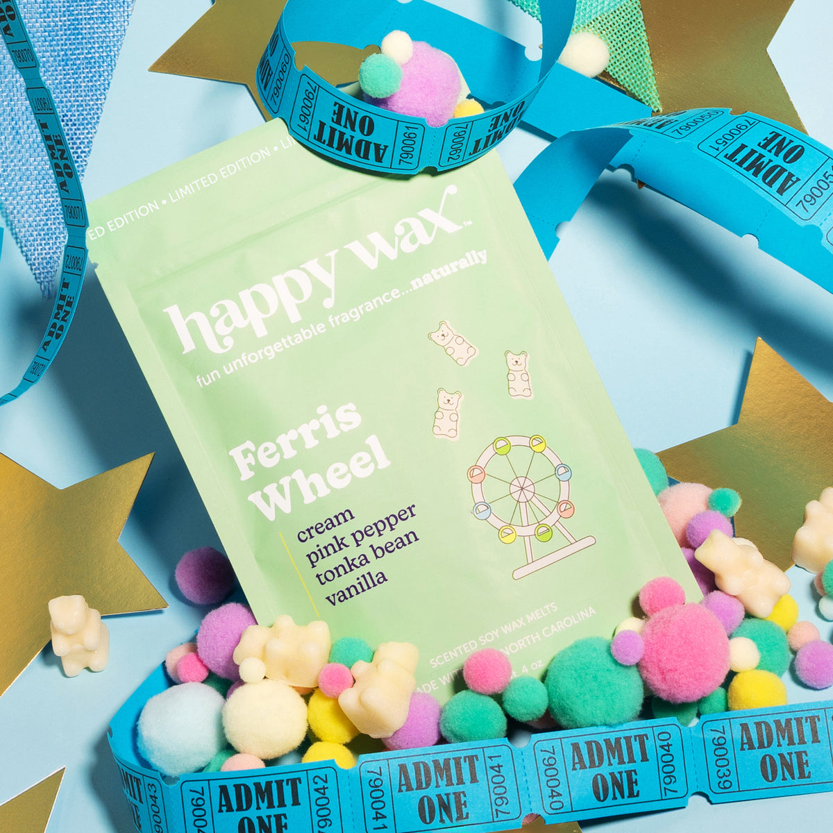 Happy Wax Ferris Wheel wax melts on blue background with stars and ride tickets