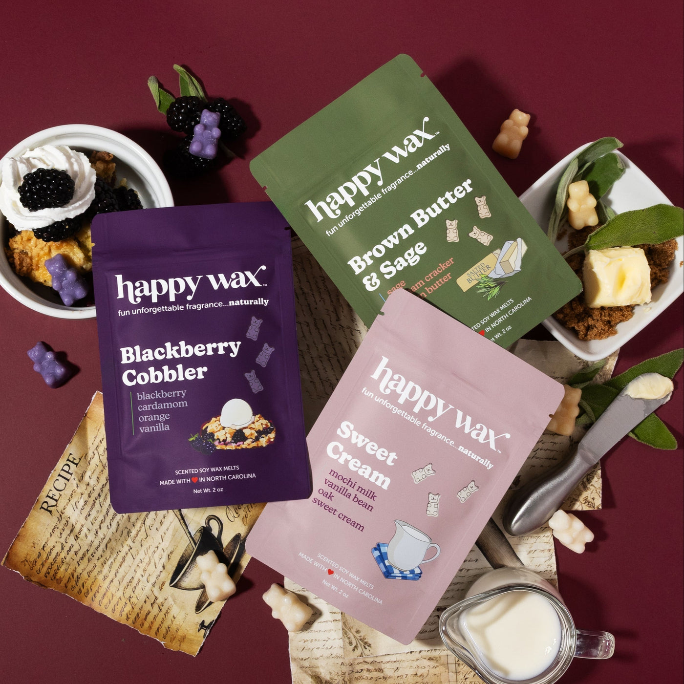 Happy Wax From Scratch collection - Blackberry Cobbler, Brown Butter & Sage. and Sweet Cream with cobbler, blackberries, butter, sage, sweet cream and old recipes on a burgundy background