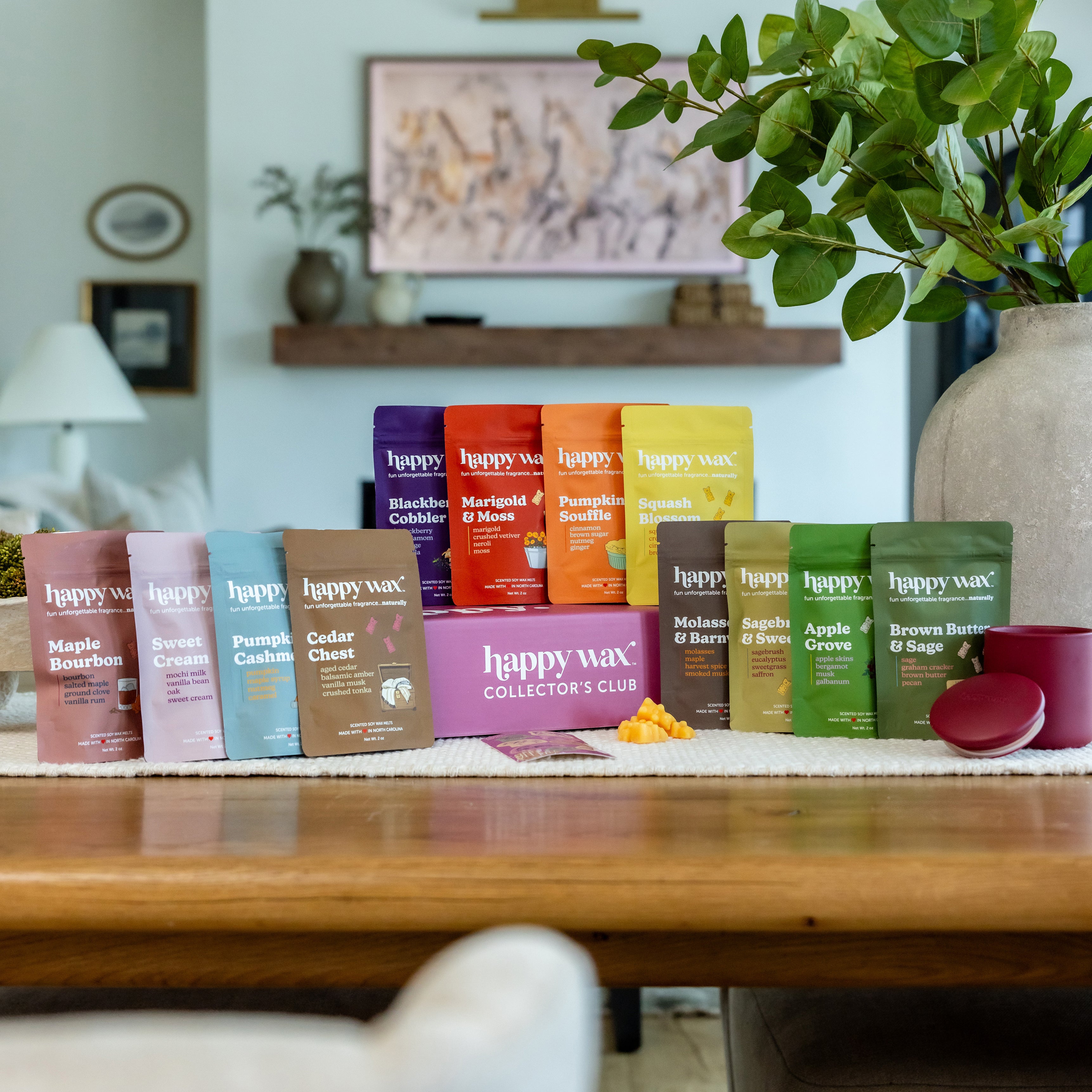 Happy Wax Golden Acre Collector's Club Fall seasonal box open displaying 13 scented wax melts in lifestyle setting