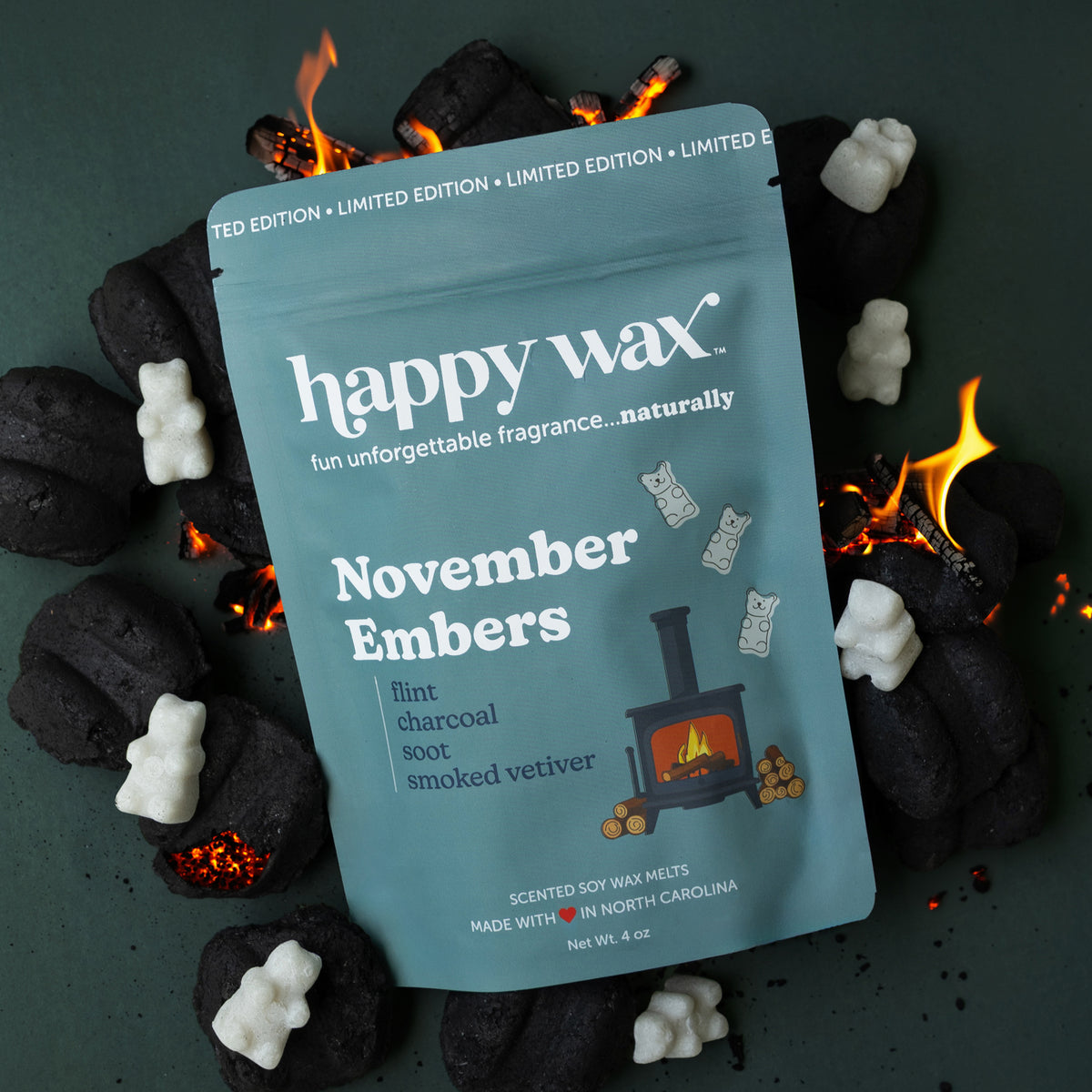 Happy Wax November Embers with coals, glowing embers and grey wax bears on dark muted green background