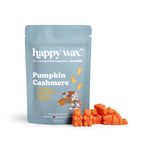 Blue pouch labeled "happy wax Pumpkin Cashmere" with orange wax melts displayed beside it.