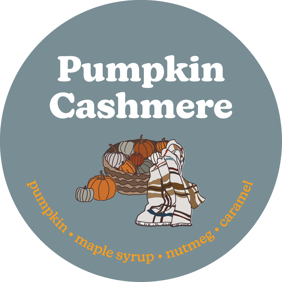 Round gray-blue label with white text reading "Pumpkin Cashmere" and illustrations of pumpkins and a plaid blanket.