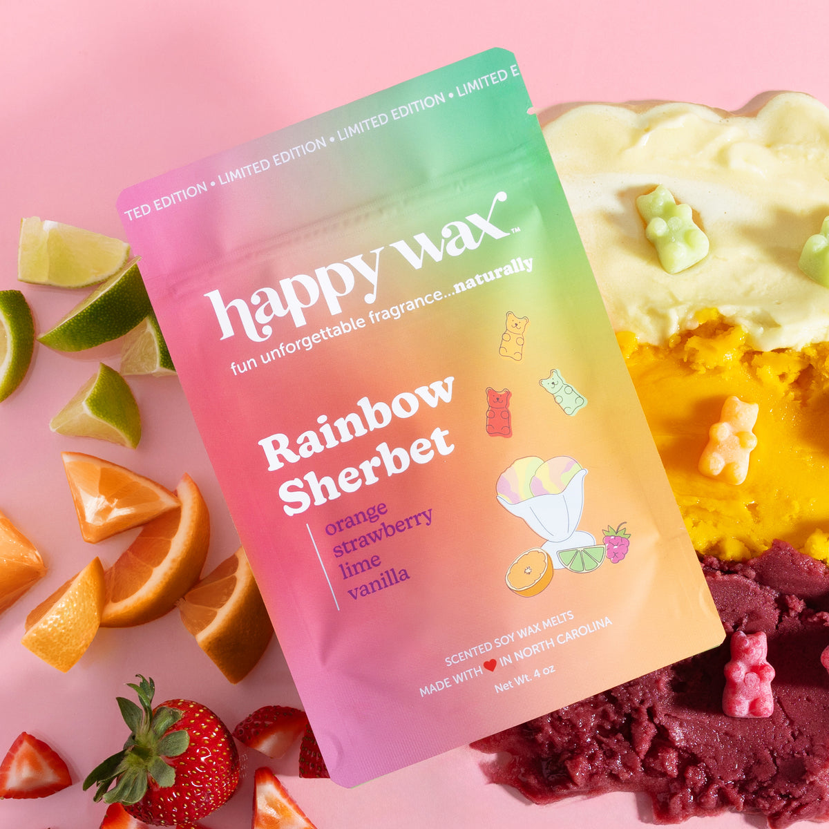 Happy Wax Rainbow Sherbet wax melt packaging with colorful wax melts on a pink background