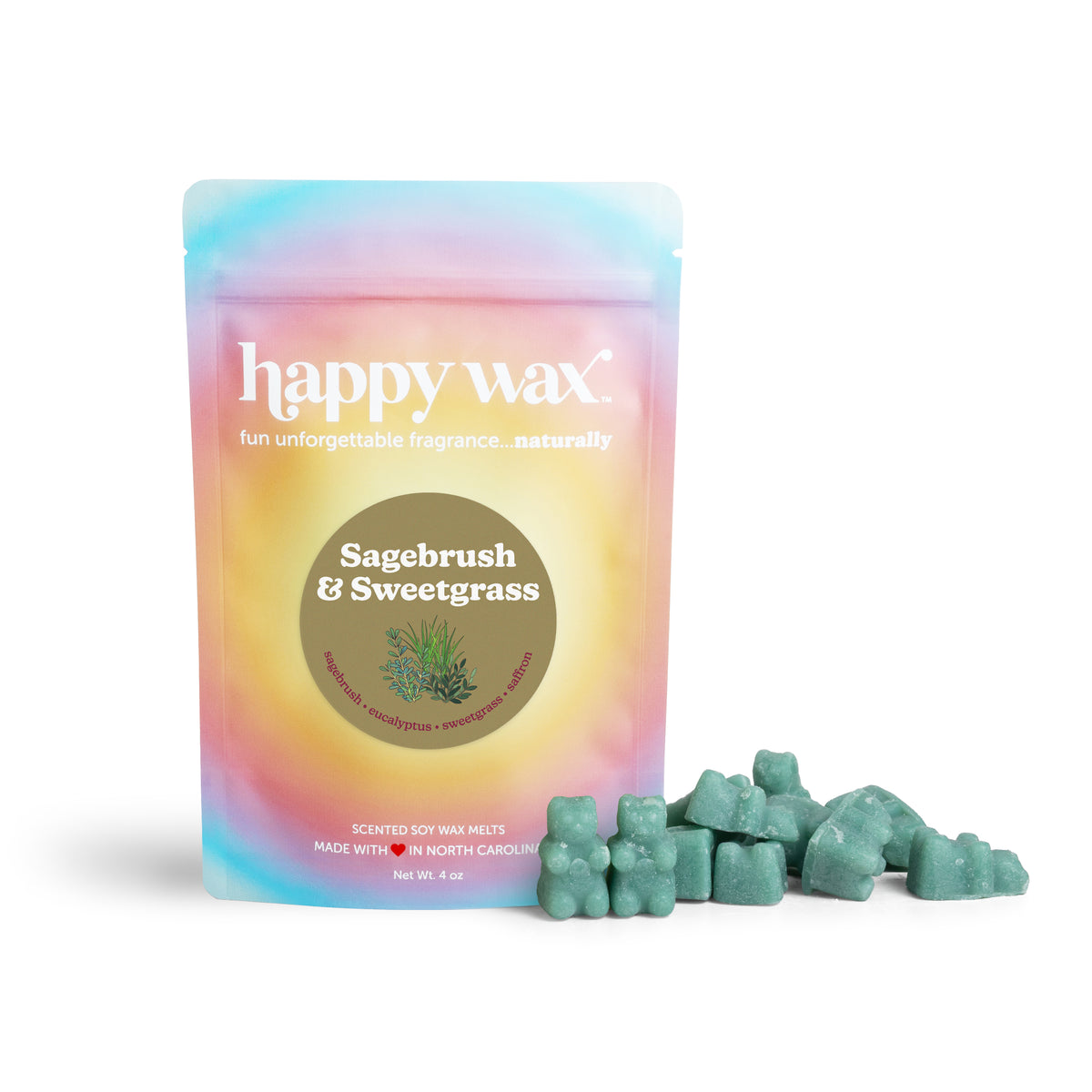 Green wax melts scattered beside a gradient pastel pouch labeled "Sagebrush & Sweetgrass" by Happy Wax.