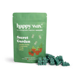 Green resealable pouch of Happy Wax brand Secret Garden scented soy wax melts with green wax chunks displayed beside it.