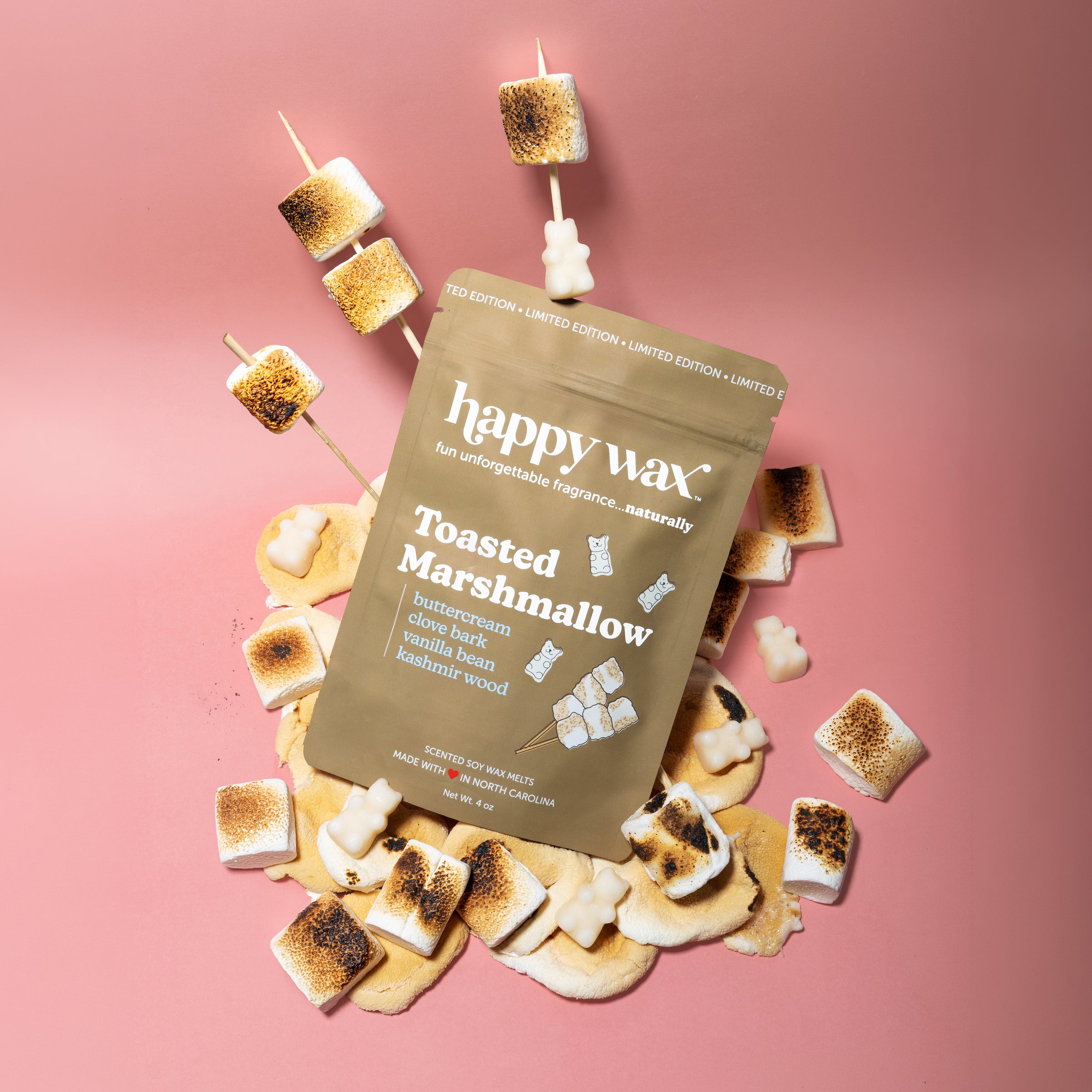 Happy Wax Toasted Marshmallow Pouch with toasted marshmallows on pink background