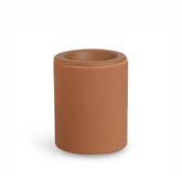 Terracotta cylindrical wax warmer with rounded rim and open top bowl.